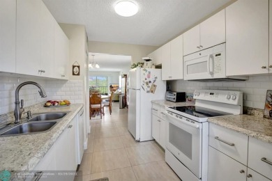 This immaculate corner unit in a newer building of a great 55+ on Flamingo Lakes Country Club in Florida - for sale on GolfHomes.com, golf home, golf lot