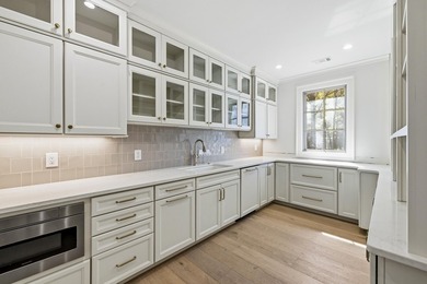 COMPLETELY RENOVATED. REIMAGINED. PRACTICALLY REBUILT FROM THE on Great Waters Course At Reynolds Plantation in Georgia - for sale on GolfHomes.com, golf home, golf lot