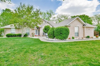 Nestled by the serene orchard of Pecan Plantation, this on Pecan Plantation Country Club in Texas - for sale on GolfHomes.com, golf home, golf lot