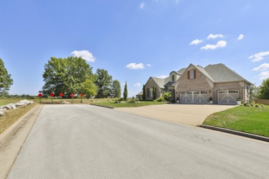This stunning all-brick and stone home in the prestigious on Rivercut Golf Course in Missouri - for sale on GolfHomes.com, golf home, golf lot