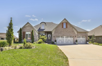 This stunning all-brick and stone home in the prestigious on Rivercut Golf Course in Missouri - for sale on GolfHomes.com, golf home, golf lot