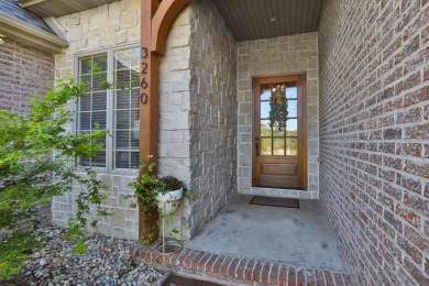 This stunning all-brick and stone home in the prestigious on Rivercut Golf Course in Missouri - for sale on GolfHomes.com, golf home, golf lot