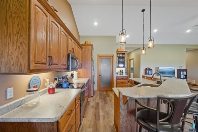 This custom-built 3-bedroom, 2-bath home backs to the 5th hole on The Bridges At Beresford in South Dakota - for sale on GolfHomes.com, golf home, golf lot