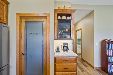 This custom-built 3-bedroom, 2-bath home backs to the 5th hole on The Bridges At Beresford in South Dakota - for sale on GolfHomes.com, golf home, golf lot