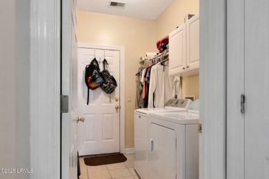 This 3-bedroom home with an office and a sunroom offers a split on Eagles Pointe Golf Club in South Carolina - for sale on GolfHomes.com, golf home, golf lot