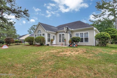 This 3-bedroom home with an office and a sunroom offers a split on Eagles Pointe Golf Club in South Carolina - for sale on GolfHomes.com, golf home, golf lot