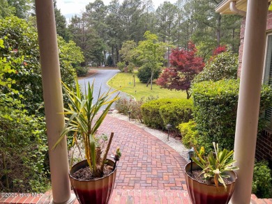 This gorgeous brick home in desirable Pinewild CC is situated on on Pinewild Country Club of Pinehurst in North Carolina - for sale on GolfHomes.com, golf home, golf lot