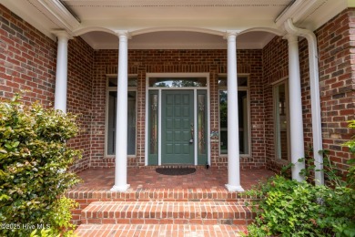 This gorgeous brick home in desirable Pinewild CC is situated on on Pinewild Country Club of Pinehurst in North Carolina - for sale on GolfHomes.com, golf home, golf lot