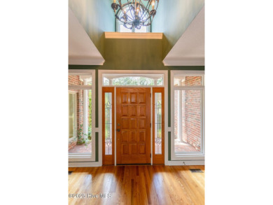 This gorgeous brick home in desirable Pinewild CC is situated on on Pinewild Country Club of Pinehurst in North Carolina - for sale on GolfHomes.com, golf home, golf lot