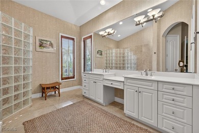 This elevated island residence offers refined tropical living in on Beachview Golf Club in Florida - for sale on GolfHomes.com, golf home, golf lot