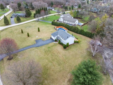 Simply stunning is this breathtaking four-bedroom, two and a on Chapel Hill Country Club in Illinois - for sale on GolfHomes.com, golf home, golf lot