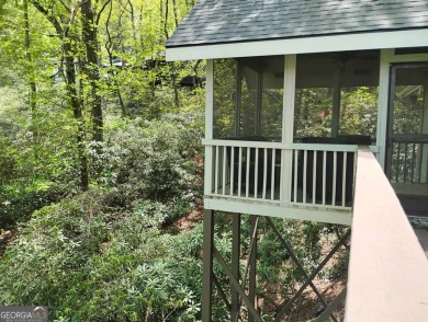 Follow the paved, winding driveway, through a Rhododendron on Sky Valley Resort and Country Club in Georgia - for sale on GolfHomes.com, golf home, golf lot