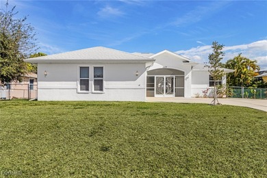 This stunning 4-bedroom, 2.5-bath waterfront pool home is on Burnt Store Golf Club in Florida - for sale on GolfHomes.com, golf home, golf lot