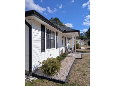 Check out this beautifully updated 2-bedroom, 2-bath home in the on Heron Point Golf Club in South Carolina - for sale on GolfHomes.com, golf home, golf lot