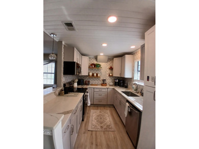 Check out this beautifully updated 2-bedroom, 2-bath home in the on Heron Point Golf Club in South Carolina - for sale on GolfHomes.com, golf home, golf lot