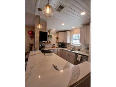 Check out this beautifully updated 2-bedroom, 2-bath home in the on Heron Point Golf Club in South Carolina - for sale on GolfHomes.com, golf home, golf lot