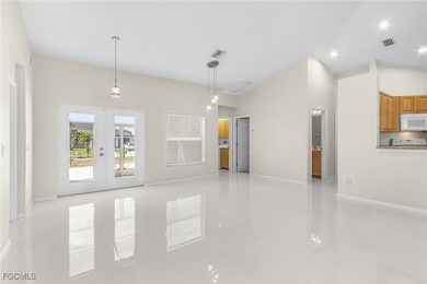 This stunning 4-bedroom, 2.5-bath waterfront pool home is on Burnt Store Golf Club in Florida - for sale on GolfHomes.com, golf home, golf lot