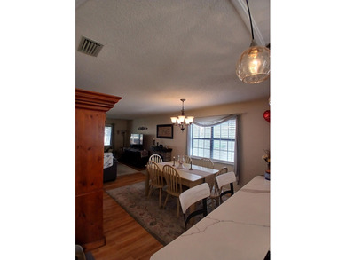 Check out this beautifully updated 2-bedroom, 2-bath home in the on Heron Point Golf Club in South Carolina - for sale on GolfHomes.com, golf home, golf lot