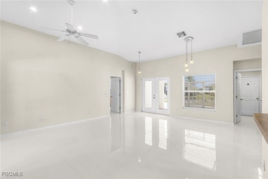 This stunning 4-bedroom, 2.5-bath waterfront pool home is on Burnt Store Golf Club in Florida - for sale on GolfHomes.com, golf home, golf lot