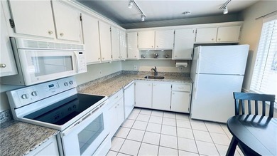 This second floor end-unit is a must see! It features a on The Glades Golf and Country Club in Florida - for sale on GolfHomes.com, golf home, golf lot