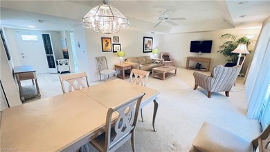 This second floor end-unit is a must see! It features a on The Glades Golf and Country Club in Florida - for sale on GolfHomes.com, golf home, golf lot