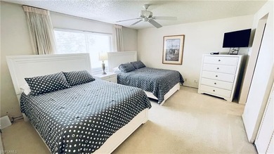 This second floor end-unit is a must see! It features a on The Glades Golf and Country Club in Florida - for sale on GolfHomes.com, golf home, golf lot