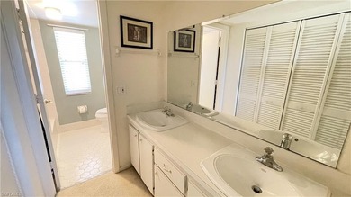 This second floor end-unit is a must see! It features a on The Glades Golf and Country Club in Florida - for sale on GolfHomes.com, golf home, golf lot