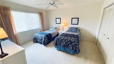 This second floor end-unit is a must see! It features a on The Glades Golf and Country Club in Florida - for sale on GolfHomes.com, golf home, golf lot