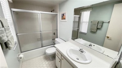 This second floor end-unit is a must see! It features a on The Glades Golf and Country Club in Florida - for sale on GolfHomes.com, golf home, golf lot