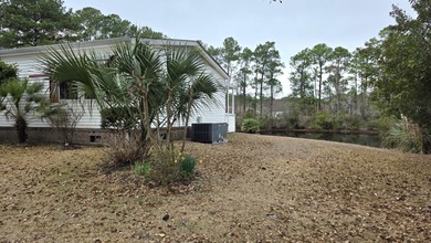 Located in the heart of beautiful Murrells Inlet, 962 Winston on Indigo Creek Golf Club in South Carolina - for sale on GolfHomes.com, golf home, golf lot