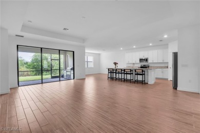 Discover refined living in this impeccably crafted home in the on Valencia Golf and Country Club in Florida - for sale on GolfHomes.com, golf home, golf lot