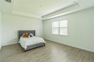 Discover refined living in this impeccably crafted home in the on Valencia Golf and Country Club in Florida - for sale on GolfHomes.com, golf home, golf lot
