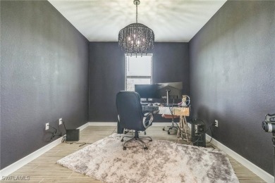 Discover refined living in this impeccably crafted home in the on Valencia Golf and Country Club in Florida - for sale on GolfHomes.com, golf home, golf lot