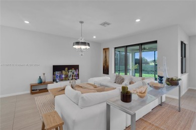 Tamarac's premier newly built community.5 beds/3.5 baths.The on Woodmont Country Club in Florida - for sale on GolfHomes.com, golf home, golf lot