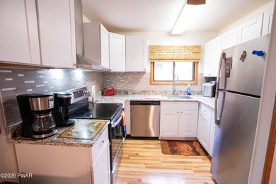 Welcome to your Pocono retreat! This spacious yet cozy on The Hideout Golf in Pennsylvania - for sale on GolfHomes.com, golf home, golf lot