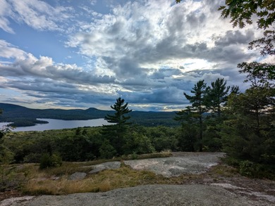 This impeccably maintained, climate-controlled, historic Log on Lucerne In Maine Golf Course in Maine - for sale on GolfHomes.com, golf home, golf lot