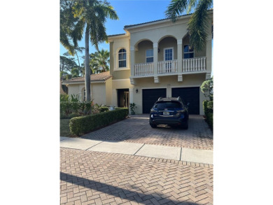 Beautifully appointed courtyard home located in an exclusive on Breakers Rees Jones Course in Florida - for sale on GolfHomes.com, golf home, golf lot