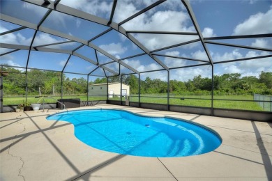 Exceptional Pool Home on 1 Acre in Indian Lake Estates - Golf on Indian Lake Estates Golf and Country Club in Florida - for sale on GolfHomes.com, golf home, golf lot