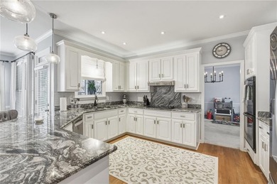 Welcome to this 5-bedroom home that sits on a corner lot and on Towne Lake Hills Golf Club in Georgia - for sale on GolfHomes.com, golf home, golf lot