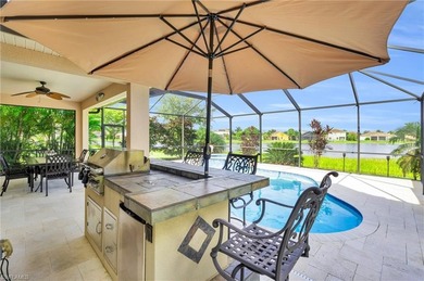 Thoughtfully positioned to capture sunsets over the lake, this on Valencia Golf and Country Club in Florida - for sale on GolfHomes.com, golf home, golf lot