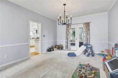 Welcome to this 5-bedroom home that sits on a corner lot and on Towne Lake Hills Golf Club in Georgia - for sale on GolfHomes.com, golf home, golf lot