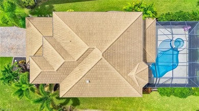 Thoughtfully positioned to capture sunsets over the lake, this on Valencia Golf and Country Club in Florida - for sale on GolfHomes.com, golf home, golf lot