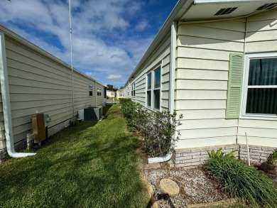 Location, Location, Location! This generously sized home is on Lake Henry Golf Club in Florida - for sale on GolfHomes.com, golf home, golf lot