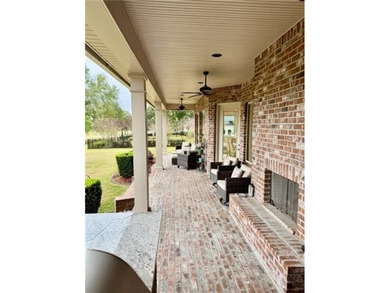 Stunning home with expansive windows overlooking the #3 fairway on Money Hill Golf and Country Club in Louisiana - for sale on GolfHomes.com, golf home, golf lot