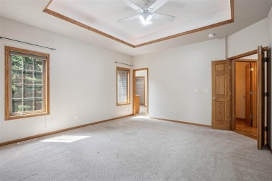 Welcome to a home where elegance meets everyday comfort on Brown Deer Golf Club in Iowa - for sale on GolfHomes.com, golf home, golf lot