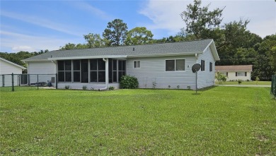This two-bedroom, two-bathroom home with a two-car garage is on Royal Oaks Golf Club in Florida - for sale on GolfHomes.com, golf home, golf lot