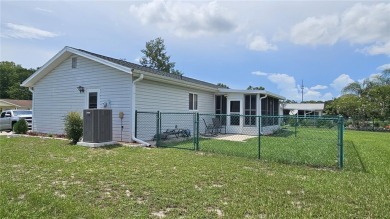 This two-bedroom, two-bathroom home with a two-car garage is on Royal Oaks Golf Club in Florida - for sale on GolfHomes.com, golf home, golf lot