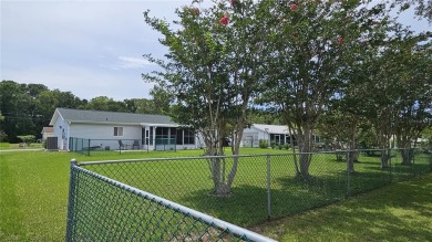 This two-bedroom, two-bathroom home with a two-car garage is on Royal Oaks Golf Club in Florida - for sale on GolfHomes.com, golf home, golf lot