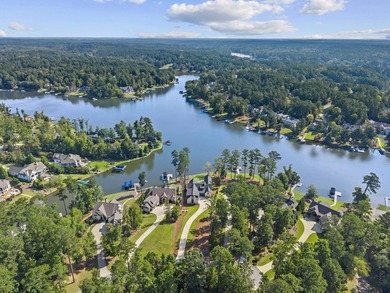 MODERN CALIFORNIA-INSPIRED LAKEFRONT RETREAT WITH POOL | Built on Harbor Club Golf and Country Club in Georgia - for sale on GolfHomes.com, golf home, golf lot