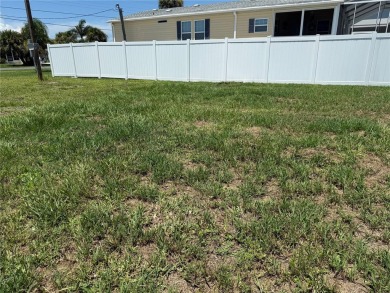 NEW PRICE on this SALTWATER CANAL-FRONT LOT with SEAWALL on Oyster Creek Golf Club in Florida - for sale on GolfHomes.com, golf home, golf lot